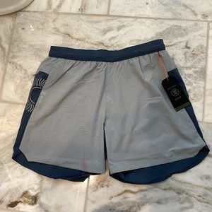 NWT Roark run amok Alta light running shorts. Brief liner 5” inseam. Blue. Small